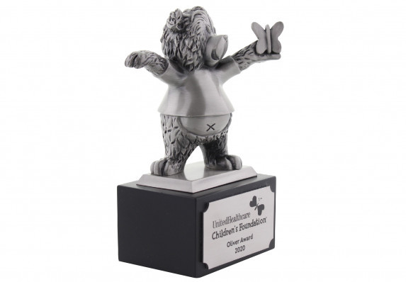Highly-detailed custom metal trophy in the form of a bear and butterfly on a black base.
