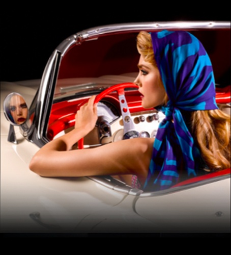 America at 250 — woman in red car