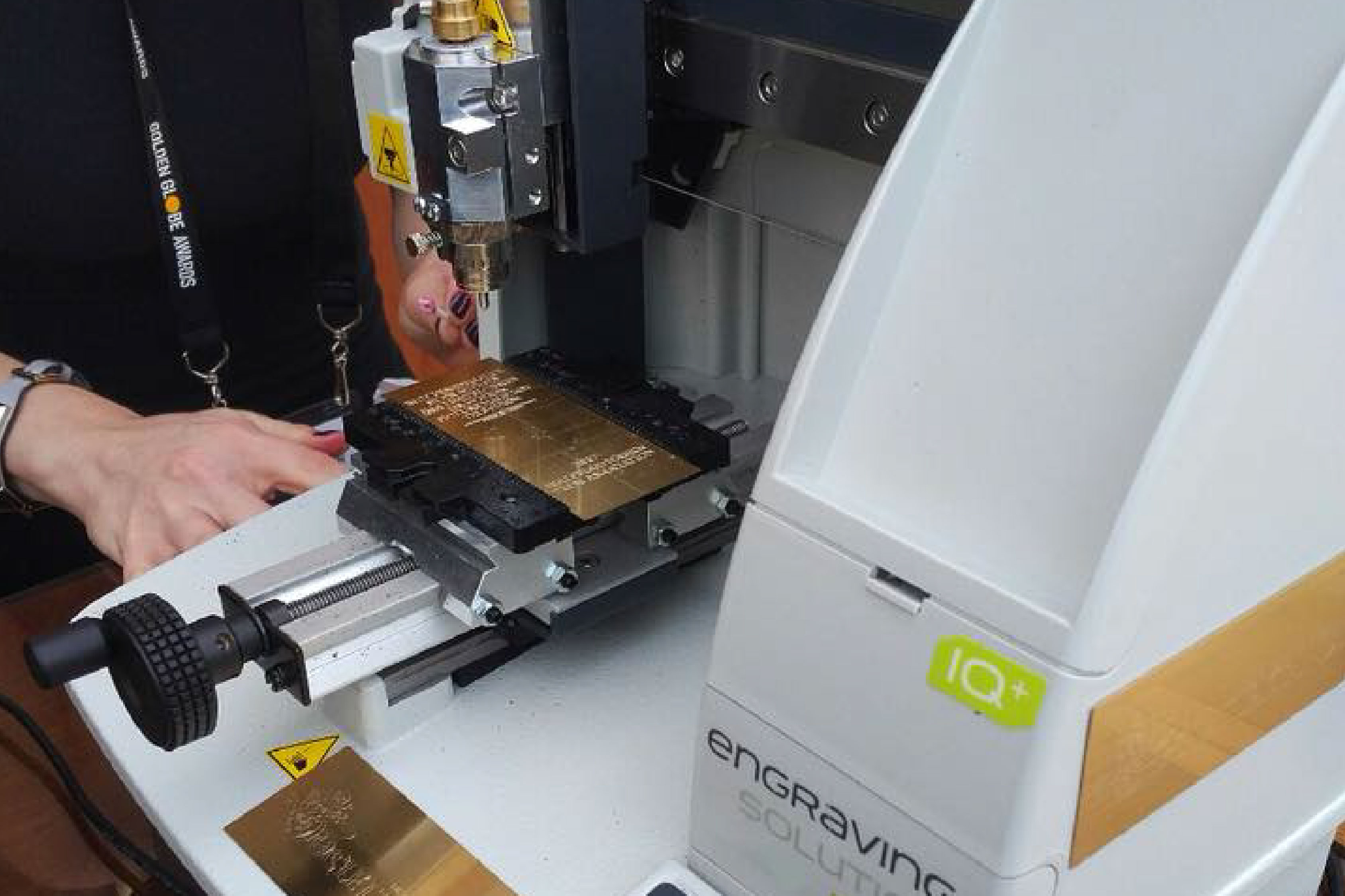 Society Awards Engraving Machine personalizing trophies at the 75th Annual HFPA Golden Globes