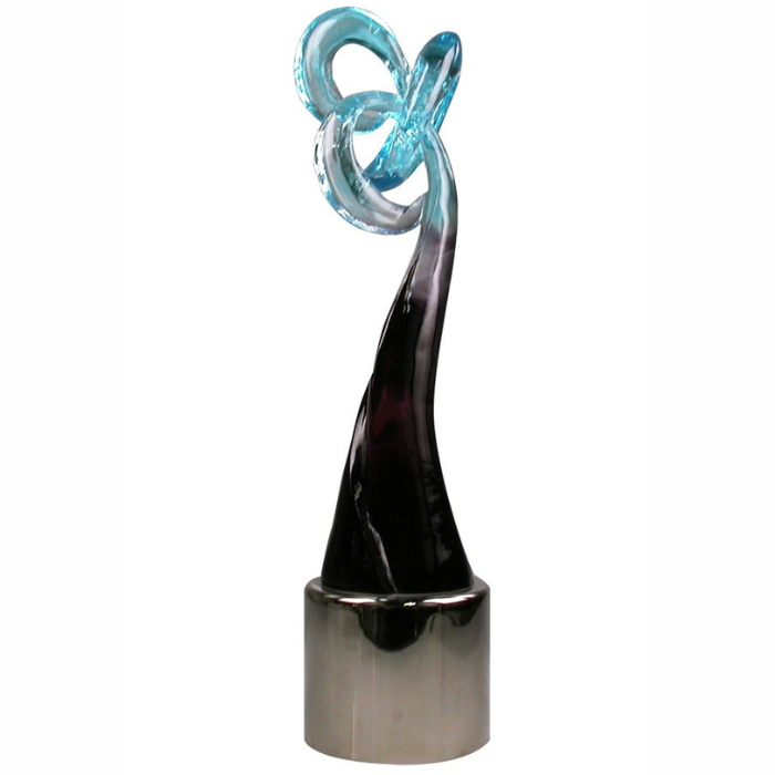 Gorgeous pate de verre cast crystal sculpture with blue, silver, and black color fade. Art glass sculpture is mounted on a polished metal base.