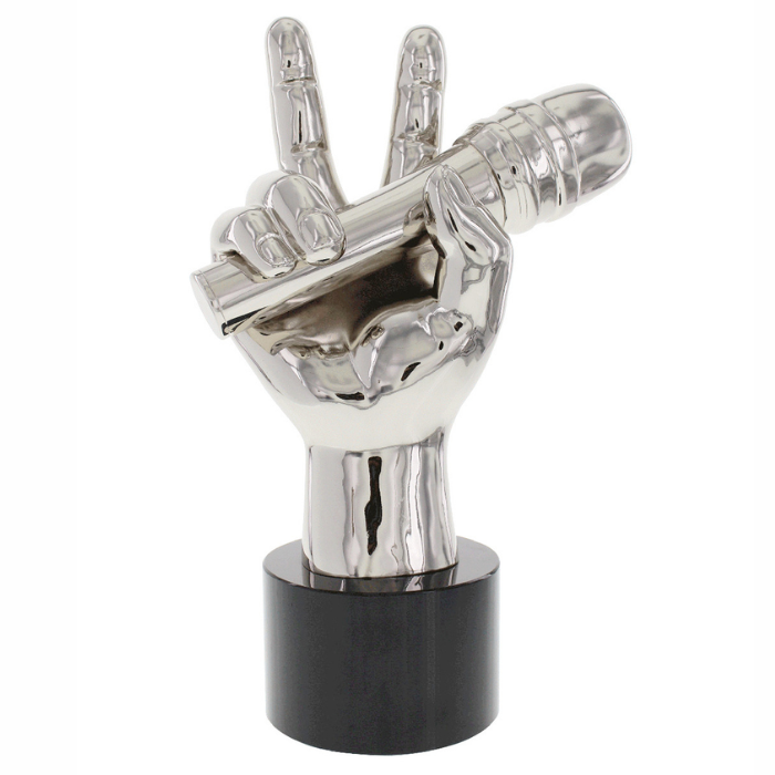 The Voice Trophy specially crafted trophy in the shape of a "rock on" hand gesture. Finished in satin silver and mounted on a black base.