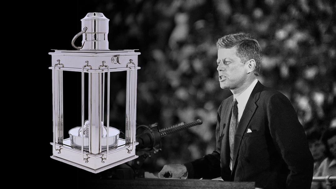 JFK Profile in Courage Award on a black background next to President JFK giving a speech