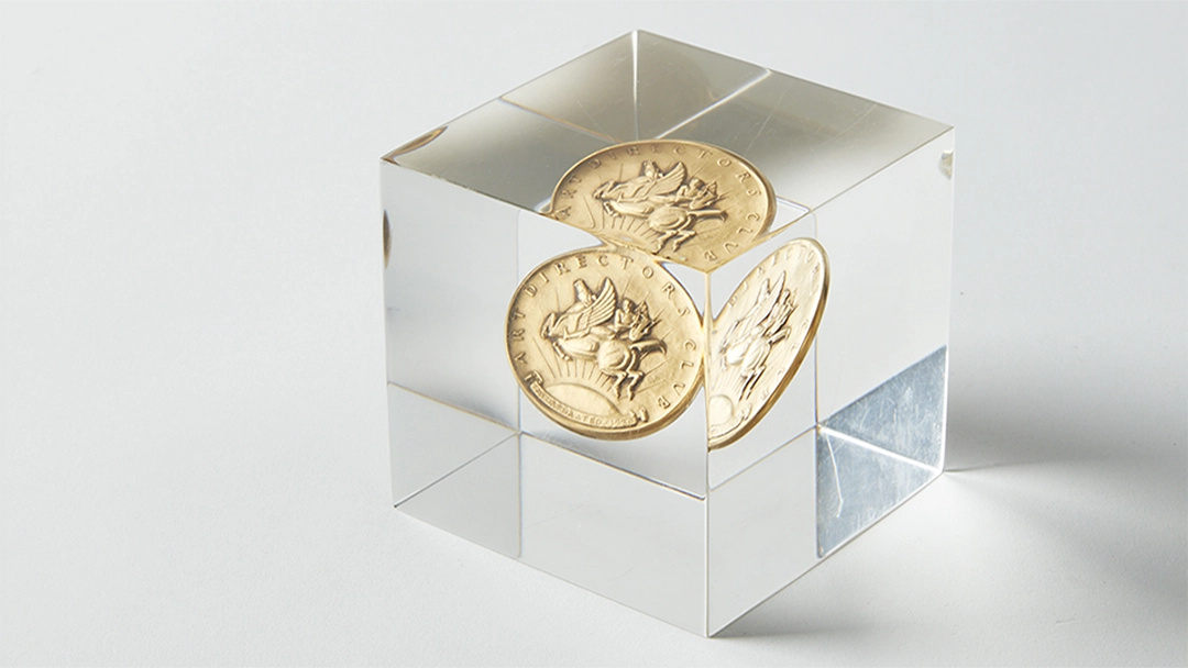 2026 Art Director's Club Awards Paul Manship Trophy with original design Paul Manship medal incased in an acrylic cube