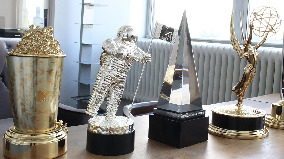 The MTV Movie Award, MTV Music Awards Moon Person Trophy, the American Music Awards AMA Trophy, and the EMMYs trophy on a desk in the former Society Awards office