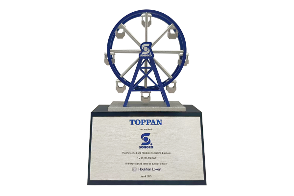Spinning ferris wheel deal toy on black crystal base with text on steel plate