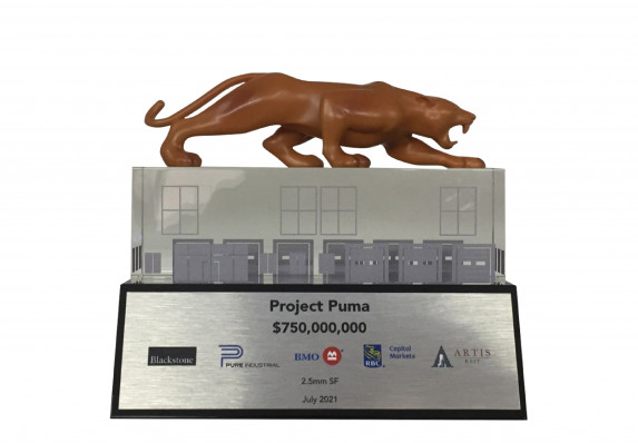 A luxury custom financial tombstone with a 3D printed puma crafted by Society Awards Finance Group for an acquisition deal.