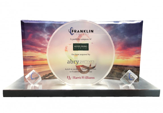 This exceptional financial tombstone features multiple plaques mounted on a low base as well as frosted etching and reverse color printing.