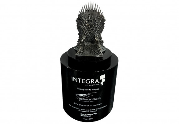 Deal gift presented at the close of an acquisition deal. Form includes a metal cast throne on a black base.