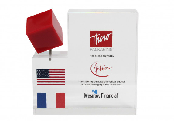 Clear acrylic financial tombstone with spinning red cube and full color logos presented at the close of an acquisition deal.