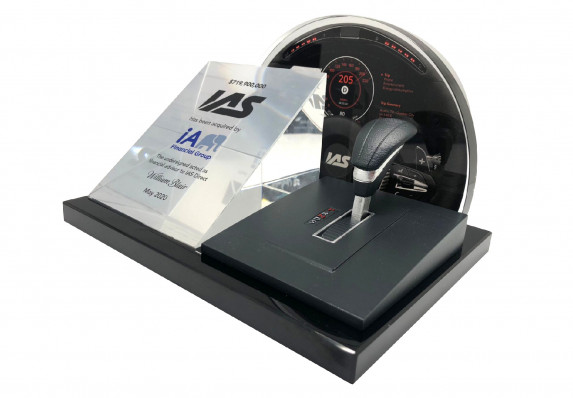 Highly-detailed deal toy with model automotive elements for an acquisition.