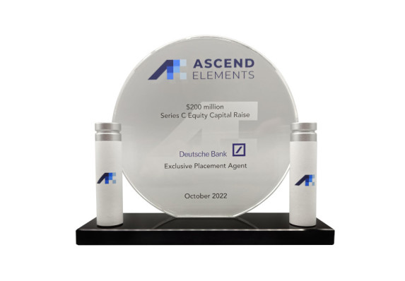 Circular deal toy made of crystal with 3-D batteries on either side of the base