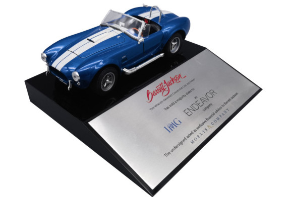 Car on top of black wedge base with metal plate