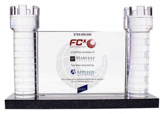 Acquisition deal gift with clear tombstone plaque between two etched crystal turrets.