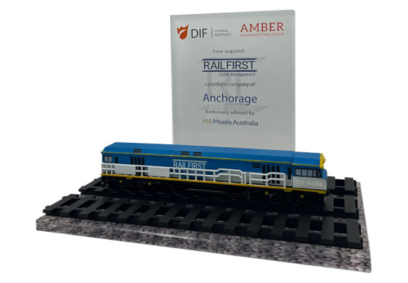 Clear crystal 3D printed train on tracks on clear base with image