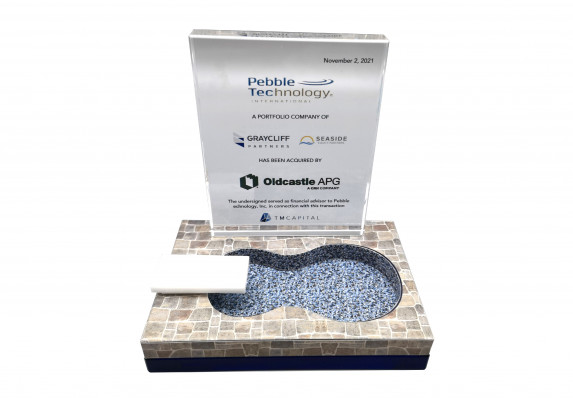 This tombstone combines a classic transaction details plaque with a playful custom model pool and diving board.