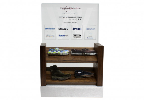 A detailed deal gift that incorporates a wood store shelf mock-up with color printed cut-out acrylic shoes. This tombstone was created for a complex, multi-acquisition deal.