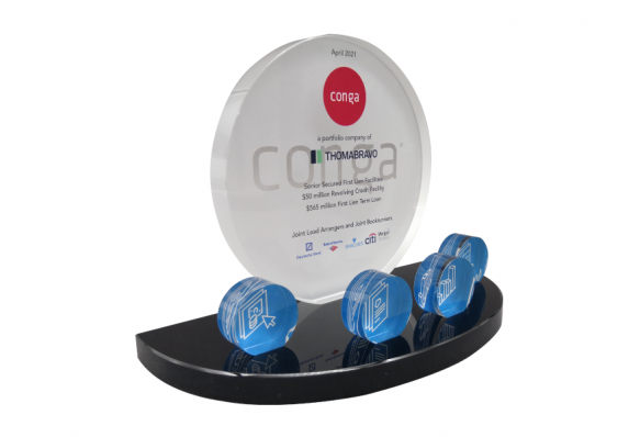 Color printed financial tombstone with cut-out icons on a black base. This deal gift was presented for a technology acquisition.