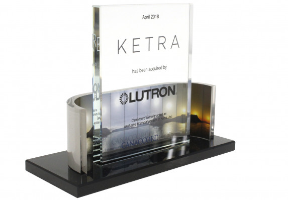 Standing crystal panel on base with metal wrap around with color images.