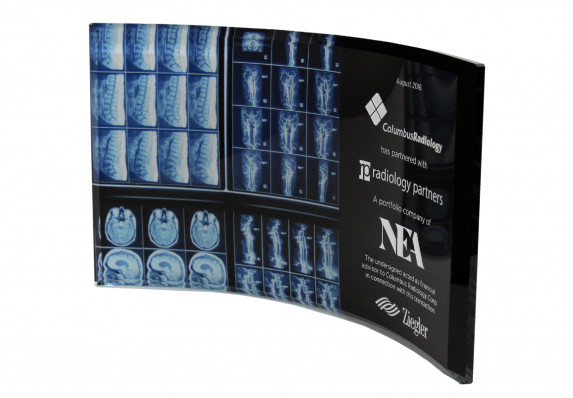 Curved glass plaque with color xray printed on reverse and financial tombstone text presented for a partnership deal.