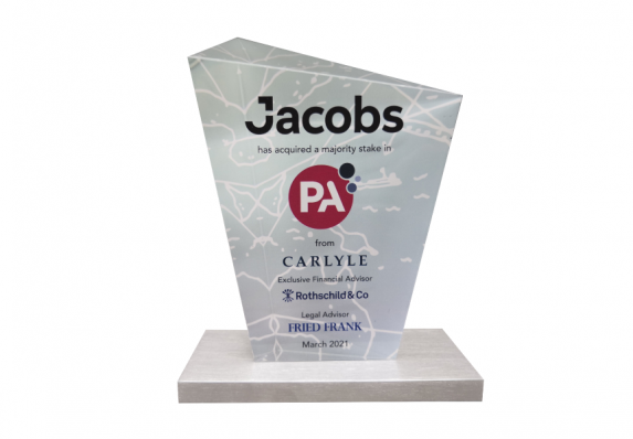 3D etched custom crystal deal toy with color printing, text and logos mounted on a flat metal base.