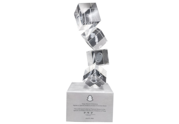 Custom cut cubes stacked with 3D etches on metal block base