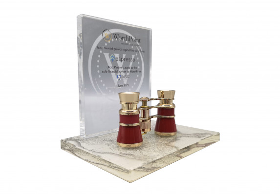 A custom deal toy with a highly-detailed binoculars mounted on a base with the details of a structured joint venture capital deal on the plaque.