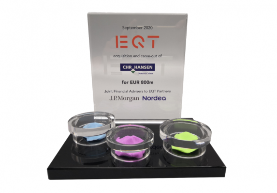 Custom deal toy created for an acquisition of a natural food coloring brand with model food coloring ingredients mounted on a black crystal base.