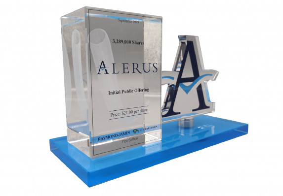 A Crystal Block Deal Gift for an Initial Public Offering Deal. The Tombstone Uses a 3-dimensional Etching Technique and Also Incorporates a Color-printed Cut-out Logo.