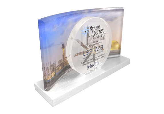 Energy deal gift featuring a curved crystal rectangle on a metal base with the deal terms printed on a circle with a reverse frosted logo icon