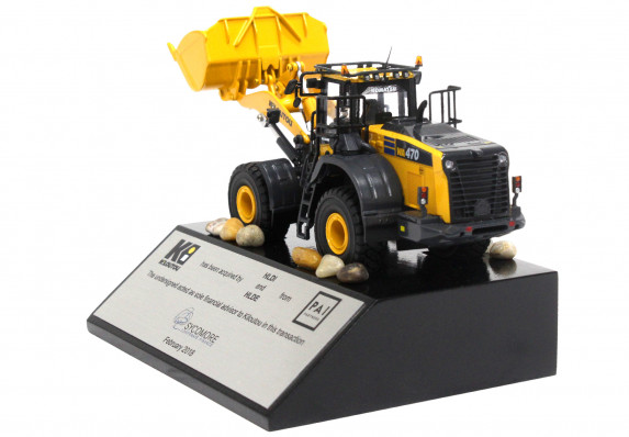 Financial advisor deal gift with a digger model mounted on a base with tombstone plaque.