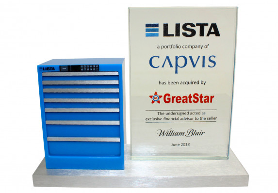 Model of tool box mounted on base next to crystal tombstone plaque.