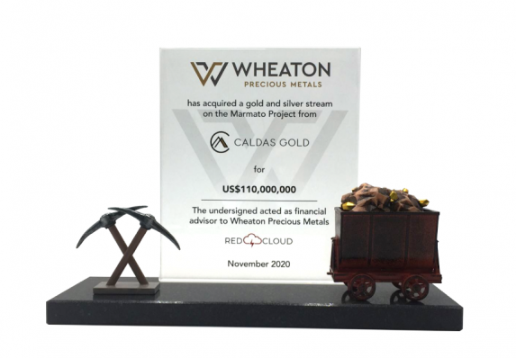 This unique custom financial tombstone includes a reverse-etched plaque with financial transaction details and model pick-axe and mining cart.