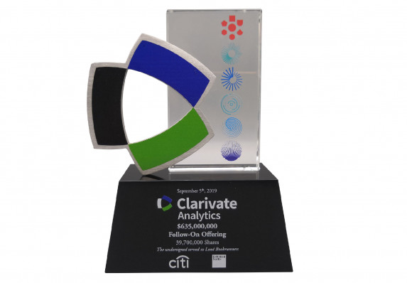 A Custom Deal Toy Presented for a Follow-on Offering. This Unique Piece Combines a Color-printed Plaque with a Cut-out Logo and Tombstone Base.