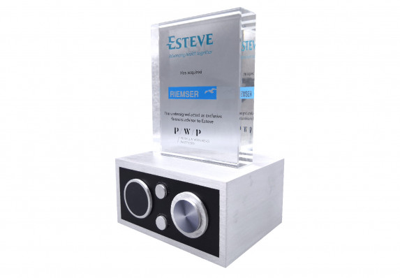 Custom financial tombstone with crystal deal toy on an aluminum medical equipment model.