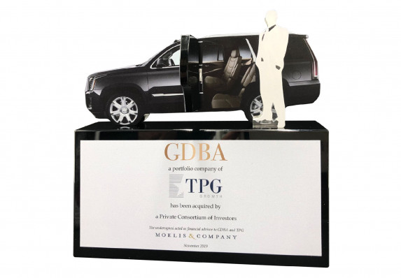 An Acquistion Deal by Investors is Commemorated in this Unique Luxury Tombstone with Color Printing, Large Logos, and Model Car.