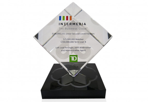 A standing cube in clear crystal and black marble base are each accented with etched logo in this loan deal tombstone.