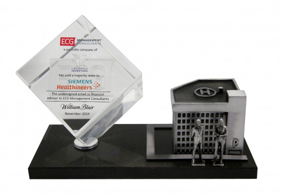 A financial tombstone crafted for sale of a majority stake in medical brand. This luxury deal toy includes a model hospital and healthcare workers.