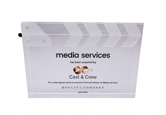 A custom acrylic deal toy presented for the acquisition of a media brand. The form is a model of a clapperboard.