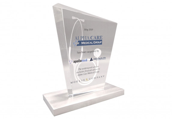 3D etched custom crystal deal toy with color printing, text and logos mounted on a flat metal base.
