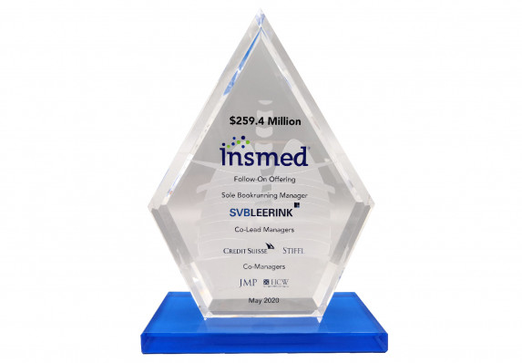 An exclusive crystal with etched images and color printed logos and text.