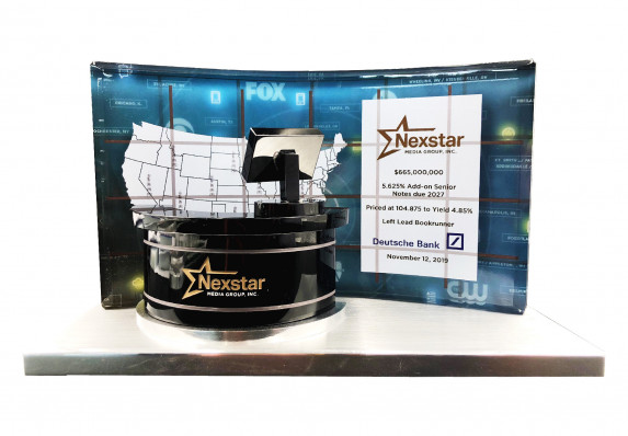 A luxury deal gift crafted for a large news media organization financial transaction. This particular piece displays the transaction details on a plaque that is made to look like a news program backdrop.