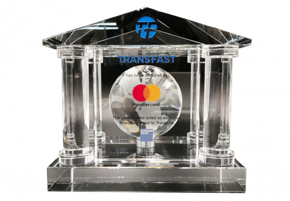A crystal financial tombstone for the acquisition of a payment processing service by a major financial institution. The design has classic architectural style