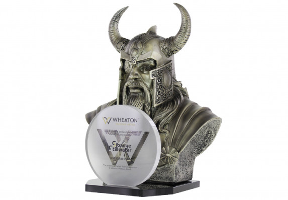 A bust of a viking is presented behind a round logo plaque in this deal gift for acquisition of a stream of precious metals.