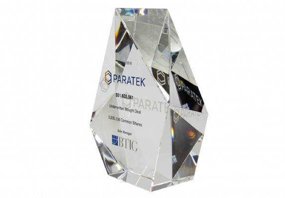 A prismatic standing deal gift with reverse etching and color logos and tombstone text.