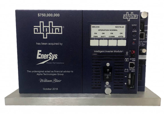 A visually realistic, 2d product model is printed on vertical plaque with transaction details of acquisition deal.