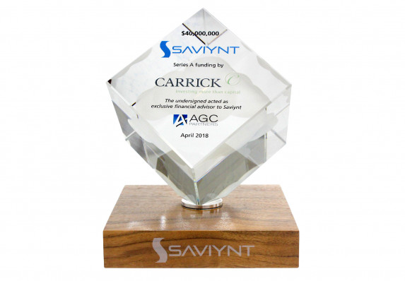 Clear cube with color printed financial tombstone text mounted on wood base. Presented at the close of a series a funding deal.