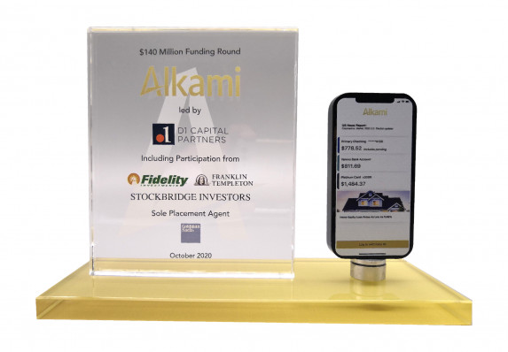 A luxury crystal deal gift with model telephone and tombstone plaque presented for the funding round of a software company.