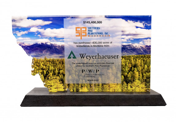 A premium acrylic deal toy crafted by Society Awards Finance Group in recognition of a large land purchase. The transaction details are presented on a reverse color printed, custom-cut plaque.