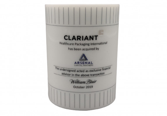 Acquisition Tombstone in the Shape of Model Product Crafted for a Medical Packaging Brand Acquisition. The Form is Made from High End Acrylic and Uses Precision Color Printing.