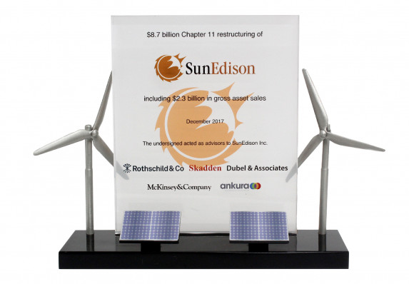 A custom deal gift with models of wind turbines and solar panels mounted on base with a full-color financial tombstone plaque.